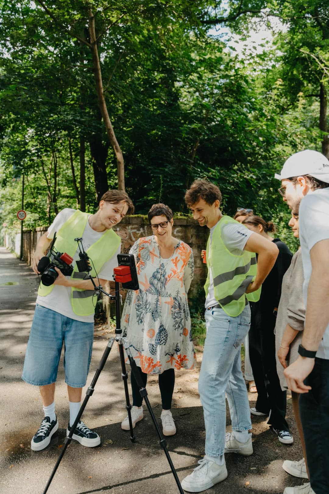 K&R behind the scenes: team reviewing footage outdoors